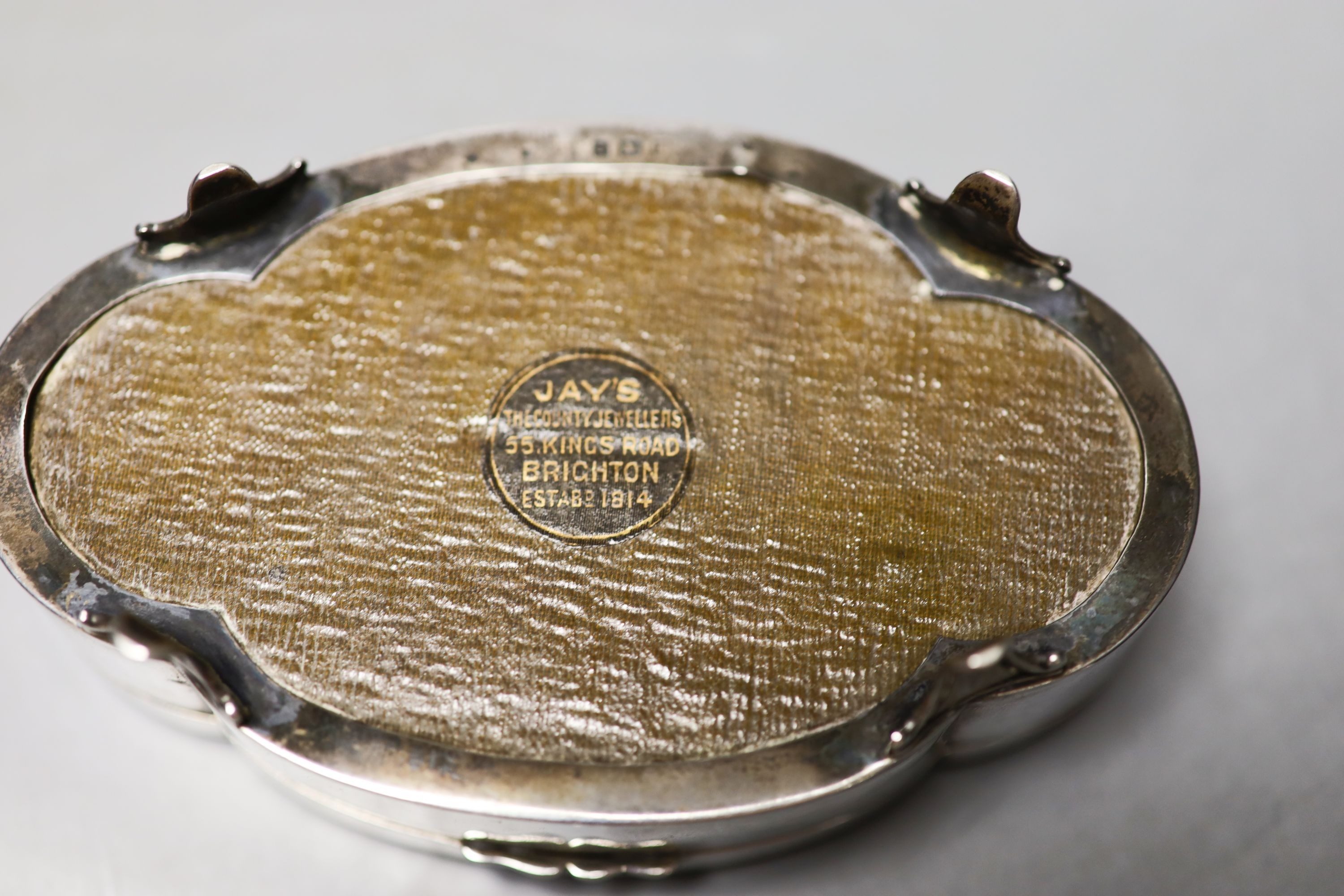 A George V part engine turned silver mounted shaped oval trinket box, Birmingham, 1911, 13.2cm.